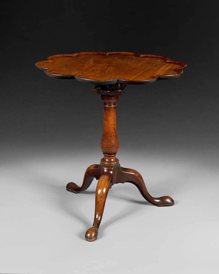 A GEORGE III MAHOGANY SCALLOP TOP TRIPOD TABLE